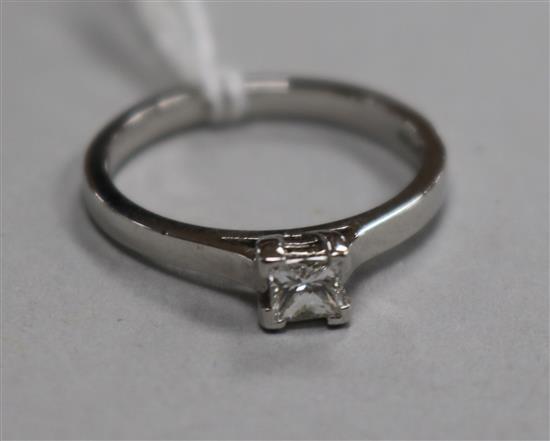 A modern platinum and solitaire princess cut diamond ring, size N.
